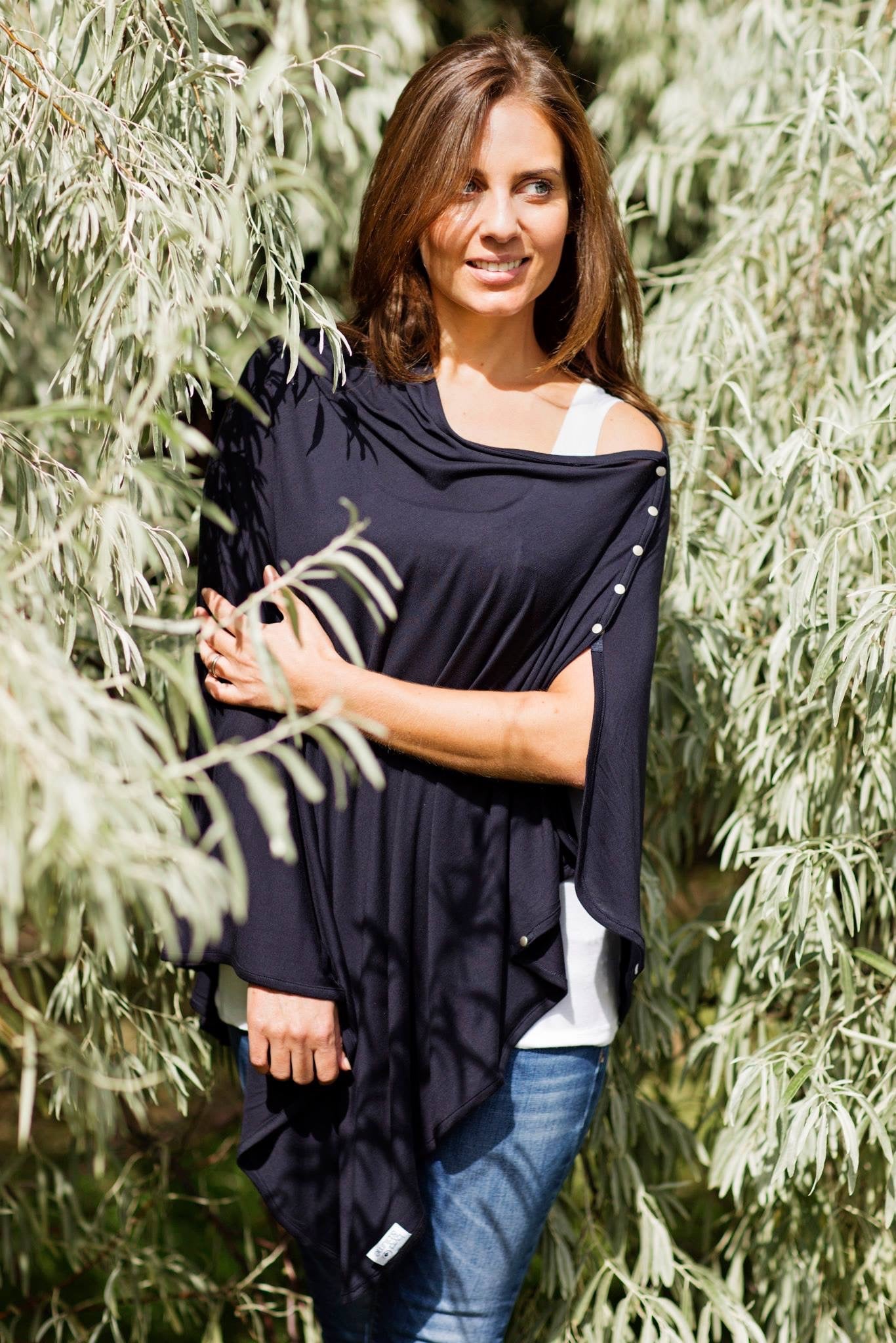 Mother nursing baby with Byrd & Blume nursing cover – discreet, lightweight, and perfect for on-the-go feeding